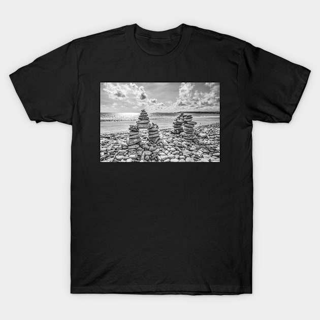 Rock Cairns On Amroth Beach, Wales, Black And White T-Shirt by tommysphotos